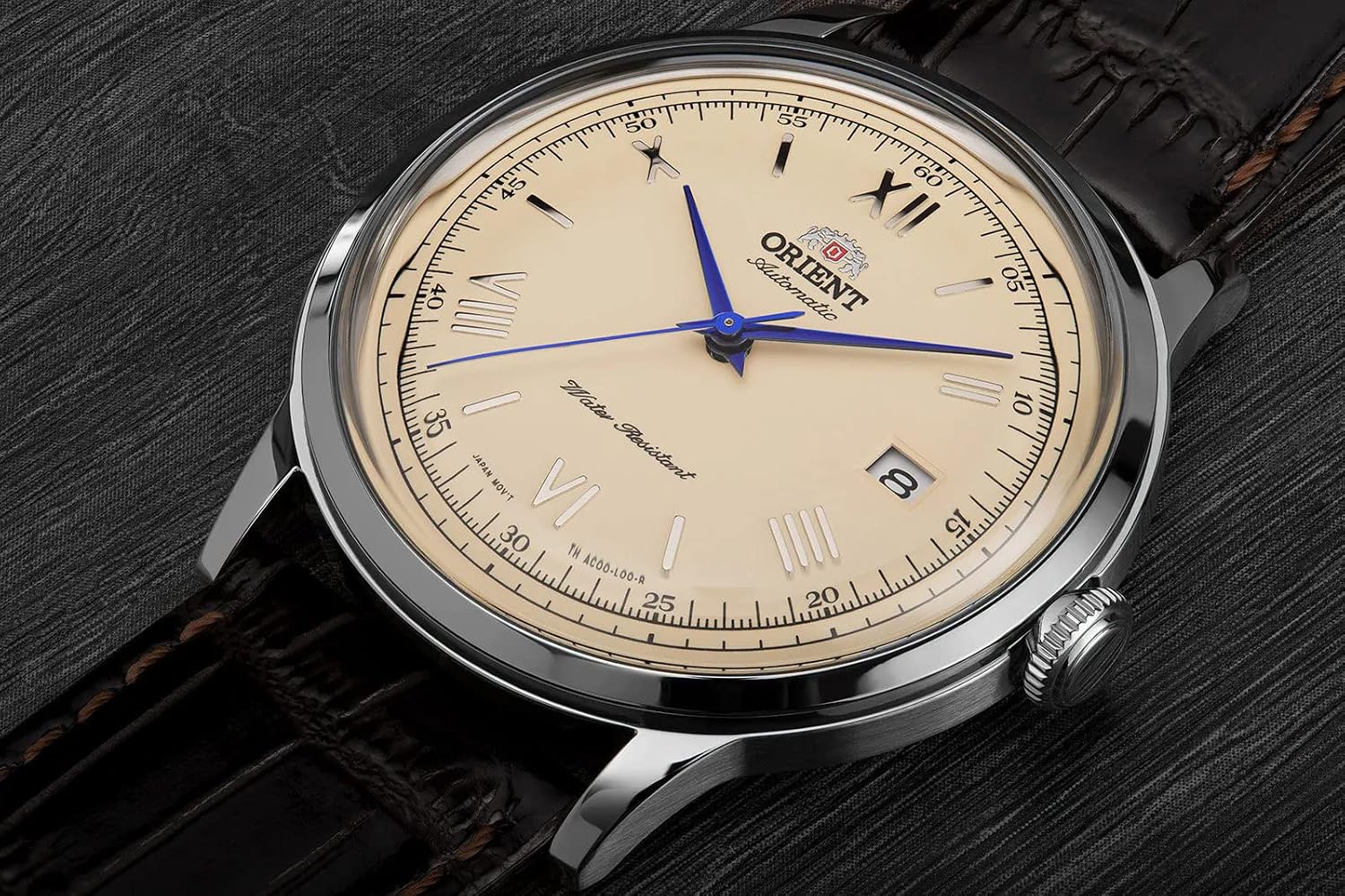 Orient Bambino Version 2 cream dial and domed crystal close-up angle